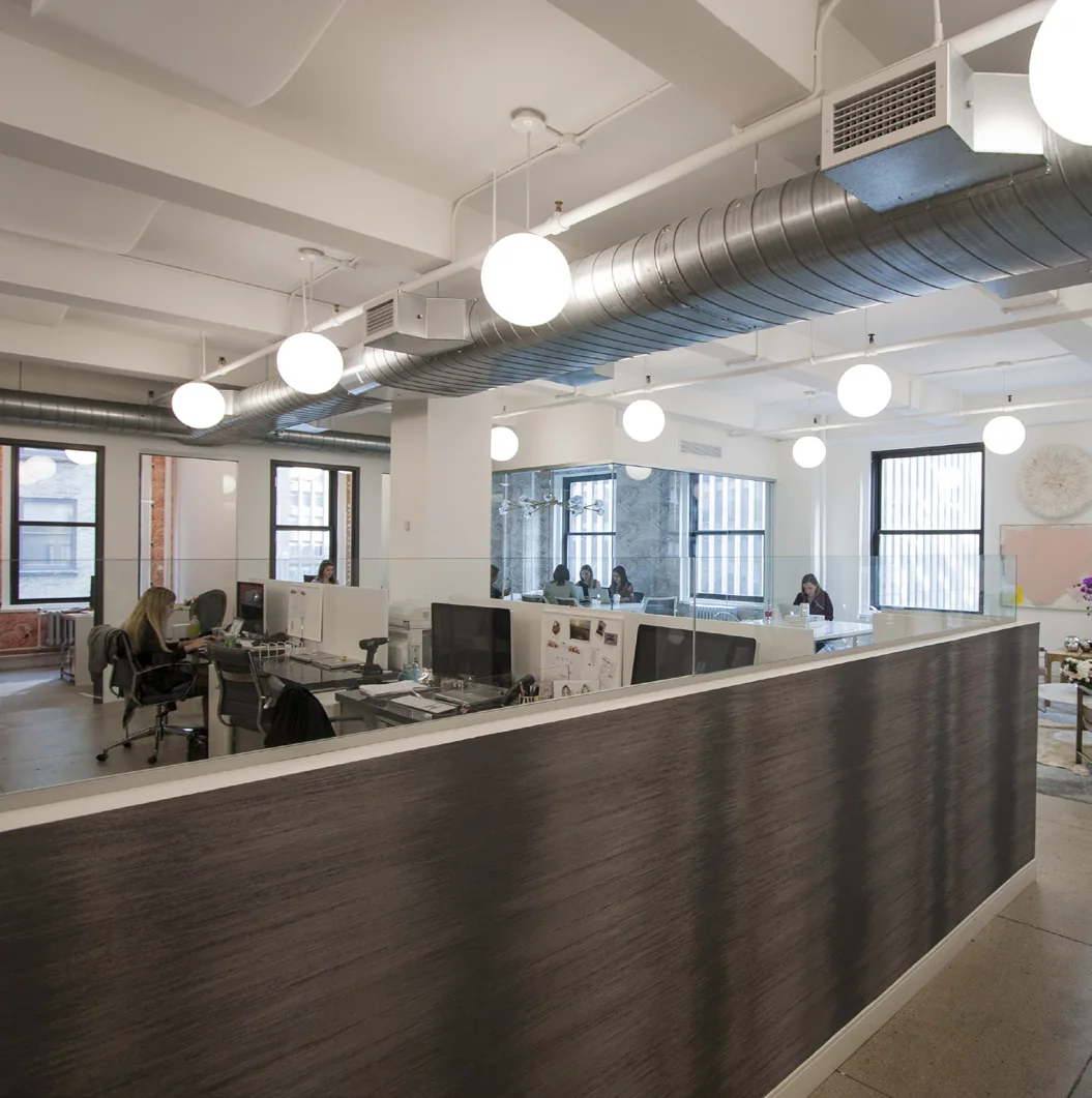 Open commercial office with polished concrete floors and white columns