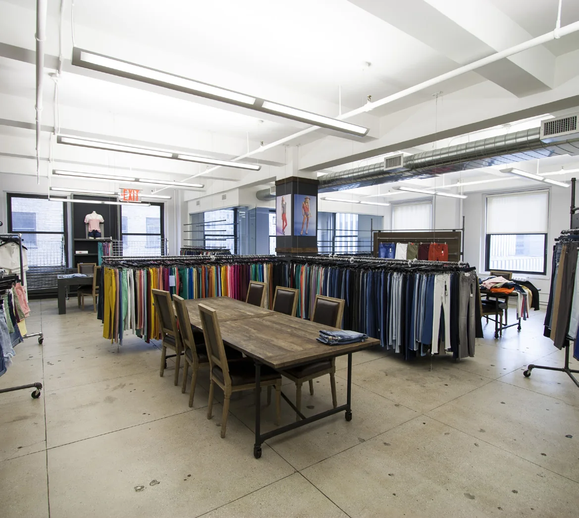 Open commercial showroom with exposed structure and perimeter windows